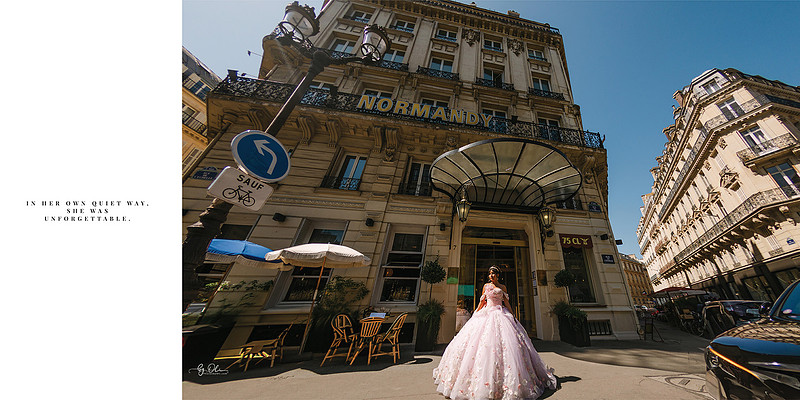 Teen girl in a pink quinceañera gown standing in front of Hotel Normandy in Paris, captured in soft editorial light.